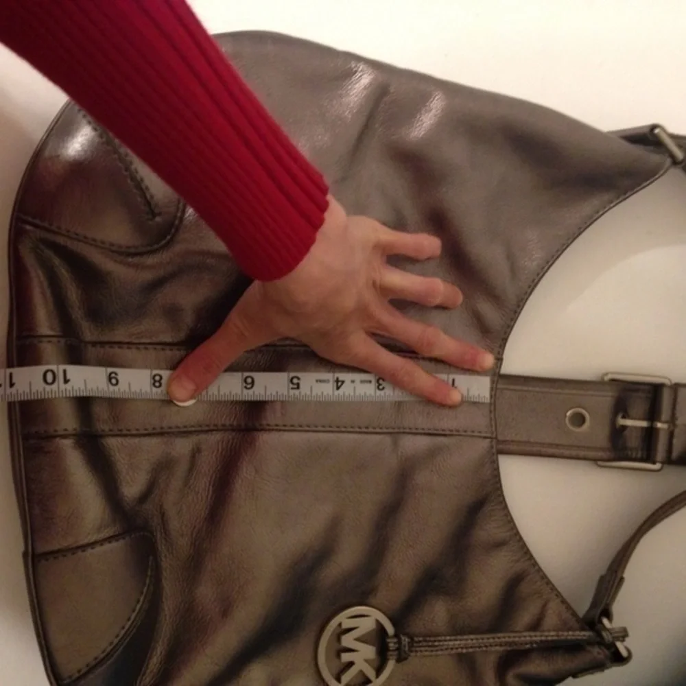 Michael Kors silver metallic hobo bag buckle